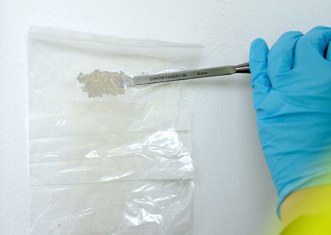 Sampling asbestos in a wall